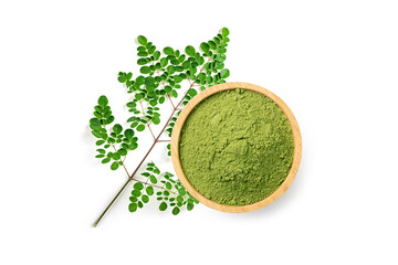 Top view of Moringa power in wooden bowl moringa leaves isolated on white background.