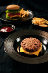 Fresh Tasty burger on dish with with french fries, ketchup