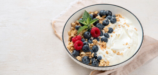 Healthy breakfast, cereal with berries and yogurt.