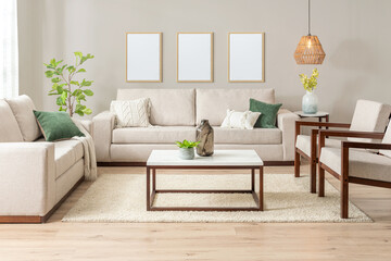 modern living room features stylish Beige couches furniture and plants providing a inviting atmosphere. Blank wooden picture frame mockup