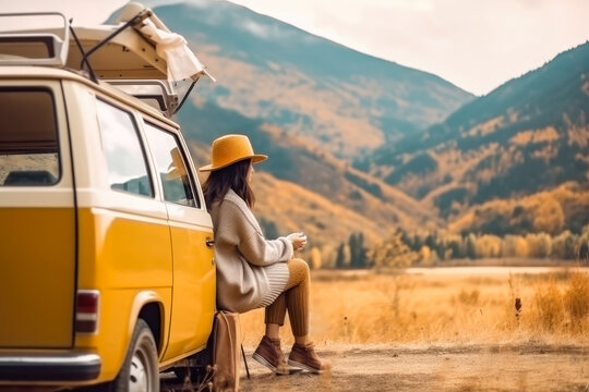 View of young woman traveler sitting on hatchback car , Happy woman traveler looking at mountain background , Created with Generate Ai Technology