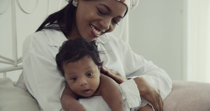 Celebrating African Culture: Mom Providing Nourishment to Her Newborn Baby Boy | Loving Care in the Comfort of Hom