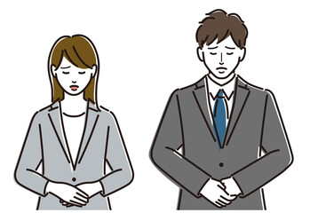 頭を下げるスーツ姿の男女