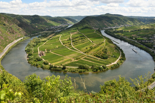 Bird's eye view of the Moselle loop surrounded by greenery and vineyards in Germany