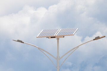 Solar powered street light on blue sky and white clouds background. Solar cell street light...