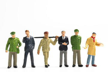 Obraz premium Miniature people different professions standing on white background and copy space for your text , Labour day concept