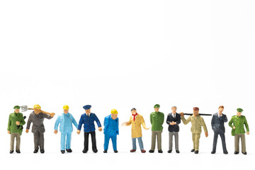 Miniature people different professions standing on white background , Labour day concept