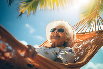 retired woman relaxing on a hammock on the tropical beach
