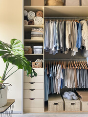Modern wardrobe with stylish women's clothing. Concept of decluttering, organizing and tidiness
