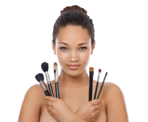 Woman, makeup and portrait of brush set for face, cosmetics or aesthetic tools isolated on transparent png background. Young female model, facial beauty and holding collection of skincare products