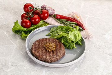 Frilled beef burger cutlet with iceberg