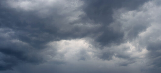 Fototapeta premium Dramatic sky with dark dense clouds before a thunderstorm