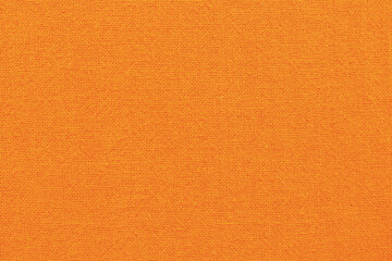 Fototapeta premium Orange cotton fabric cloth texture for background, natural textile pattern.
