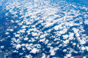 View to a land and clouds from airplane