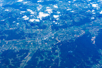 View to a land and clouds from airplane