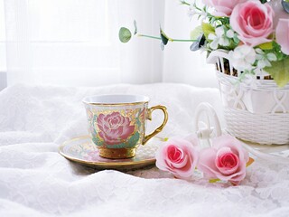 Antique cup of tea with pink rose on pink background ,Valentine's day romantic ,Mother's day ,pretty background or wallpaper ,Chinese traditional ,wedding card design ,coffee cup ,lovely love card 
