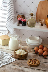 Kitchen table with ingredients for cottage cheese pancakes