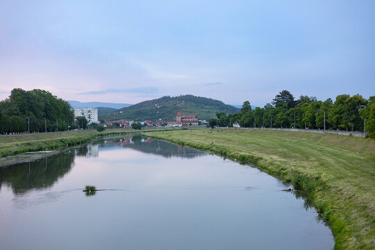 View of the river valley with mountains in the background.