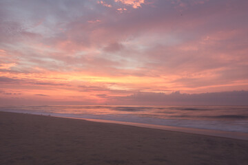 Fototapeta na wymiar Pink sunrise at Assateague Beach in Virginia.