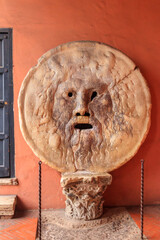 Mouth of Truth is a marble mask in Rome, Italy, which stands against the left wall of the portico...