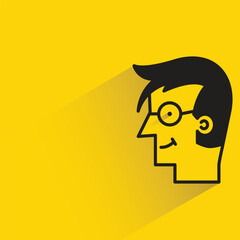 geek man side view with shadow on yellow background