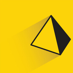 pyramid with shadow on yellow background