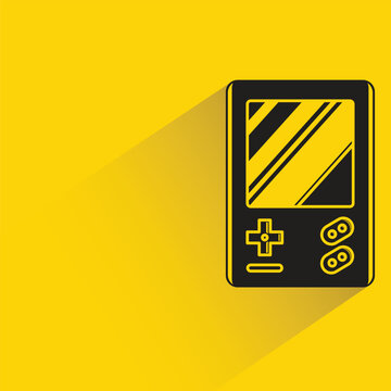 game console with shadow on yellow background
