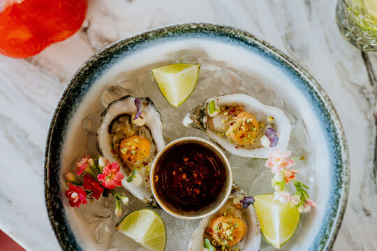 Top down close up of culinary oyster platter in restaurant