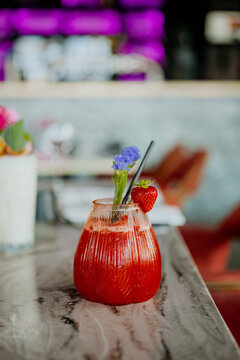 Close up of strawberry cocktail on table in restaurant