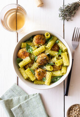 Pasta with chicken meatballs, basil and parmesan. Italian food.