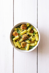 Pasta with chicken meatballs, basil and parmesan. Italian food.