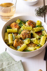 Pasta with chicken meatballs, basil and parmesan. Italian food.
