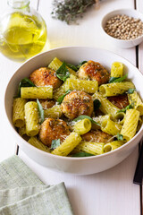 Pasta with chicken meatballs, basil and parmesan. Italian food.