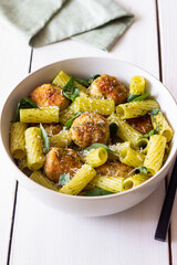 Pasta with chicken meatballs, basil and parmesan. Italian food.