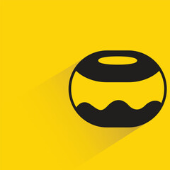 Obraz premium donut with shadow on yellow background