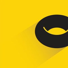 Obraz premium donut with shadow on yellow background