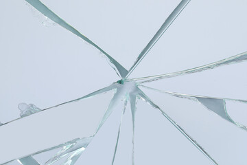 Shards of broken mirror on white background, top view