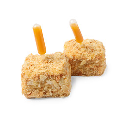 Pieces of Napoleon cake with jam pipette on white background