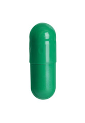 One green pill on white background. Medicinal treatment