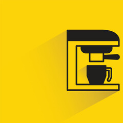 coffee machine with shadow on yellow background
