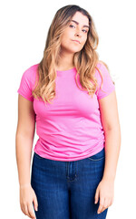 Fototapeta premium Young caucasian woman wearing sportswear relaxed with serious expression on face. simple and natural looking at the camera.