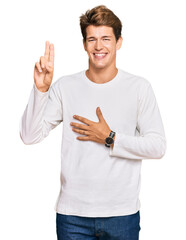 Handsome caucasian man wearing casual white sweater smiling swearing with hand on chest and fingers up, making a loyalty promise oath