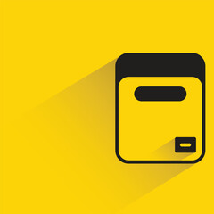 cardboard box with shadow on yellow background