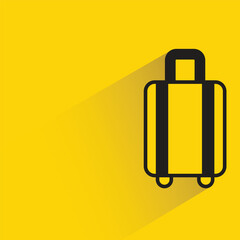 luggage bag with shadow on yellow background