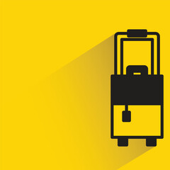 luggage bag with shadow on yellow background