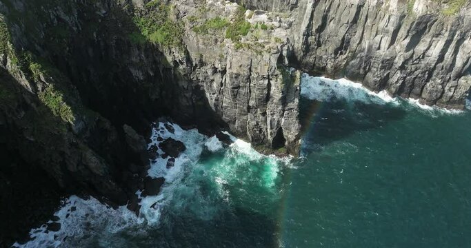 Cintr&atilde;o cliffs cliffs overhanging the ocean on the island of Sao Miguel in the Azores
