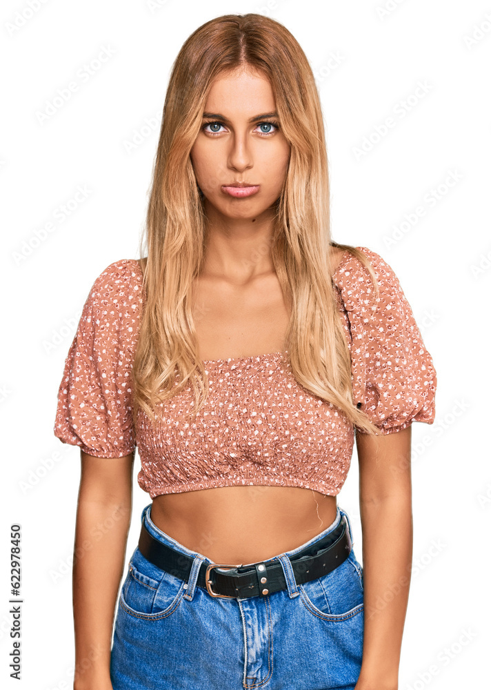 Poster beautiful blonde young woman wearing summer top depressed and worry for distress, crying angry and a