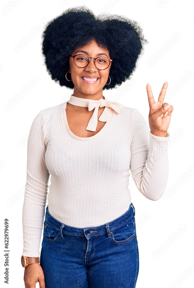 Poster Young african american girl wearing casual clothes and glasses showing and pointing up with fingers number two while smiling confident and happy.