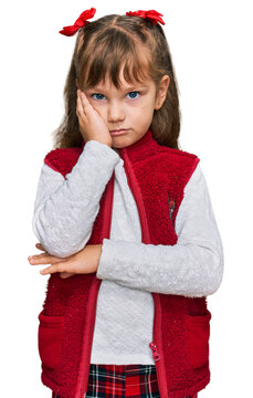 Little caucasian girl kid wearing casual clothes thinking looking tired and bored with depression problems with crossed arms.