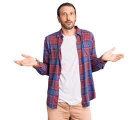 Young handsome man wearing casual clothes clueless and confused with open arms, no idea concept.